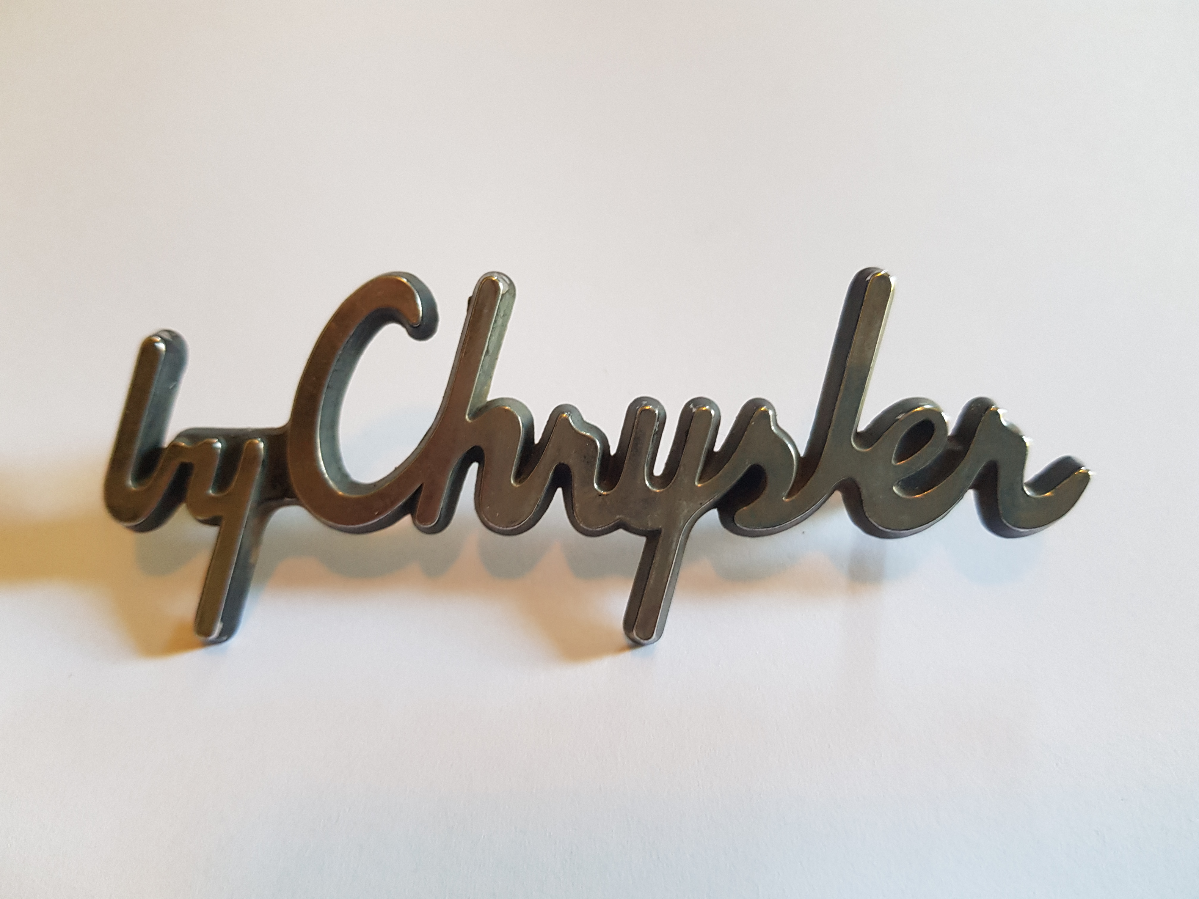 'by Chrysler' Script Badge, salvaged